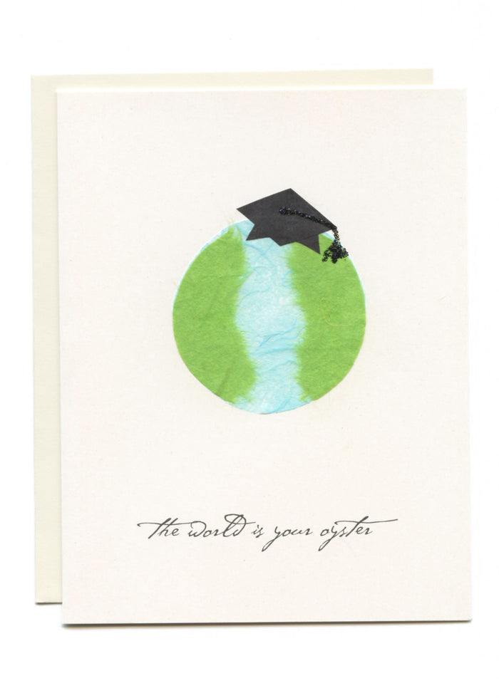 "The World is Your Oyster"  Grad Cap on Globe